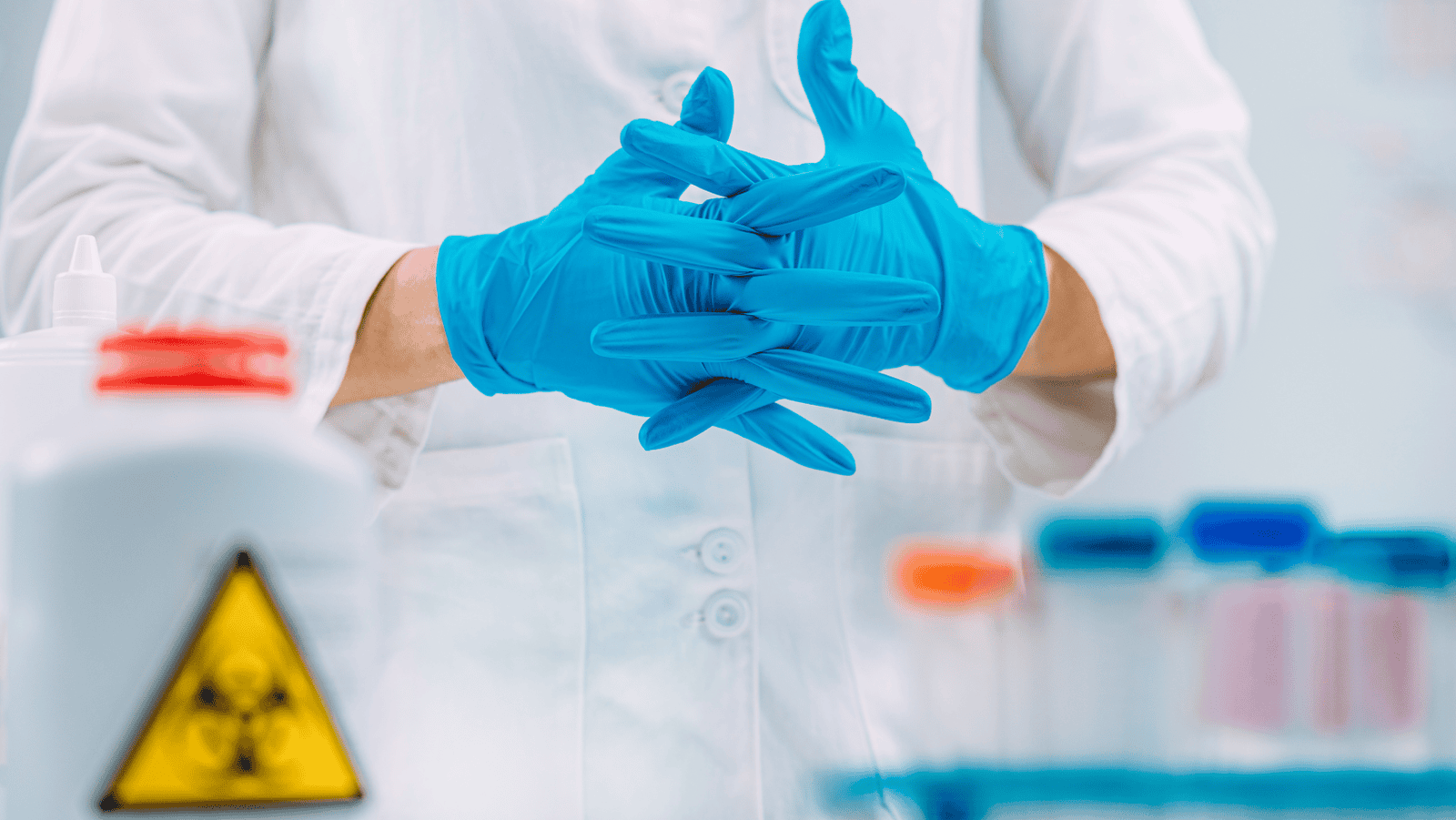 Laboratory technician wearing safety gear while conducting tests, illustrating compliance with 2024 safety protocols