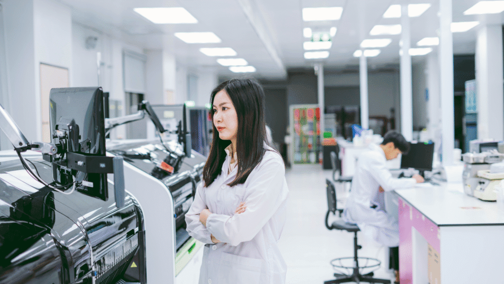 Lab technologist reviewing test results from fully automated analyzer