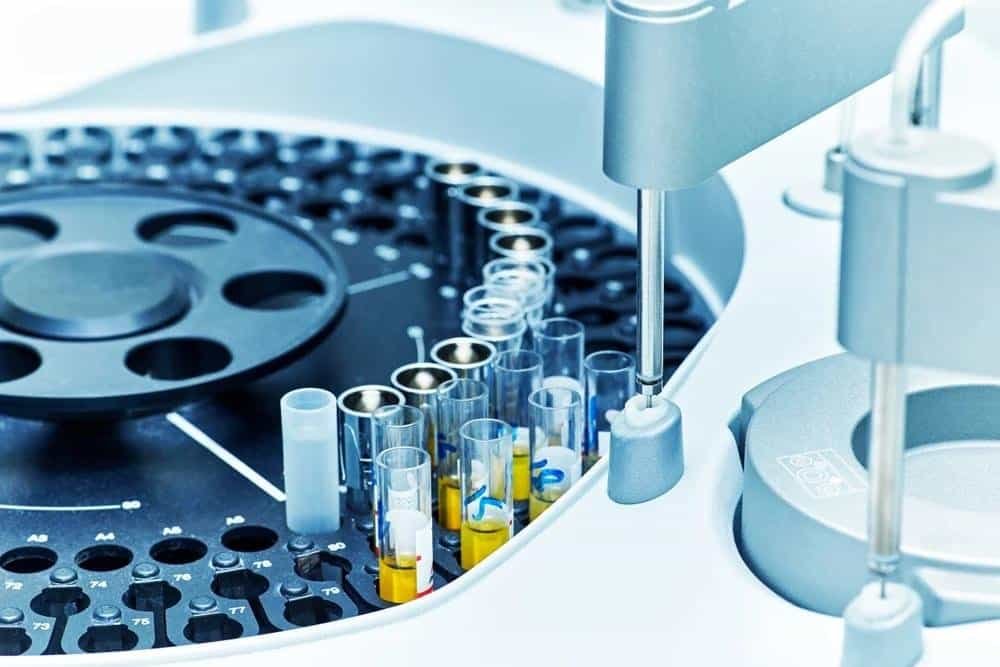 Automated clinical laboratory with digital sample tracking and high-speed analyzers